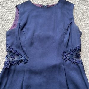 Navy blue dress with see through panel on sides and across lower back, size 10